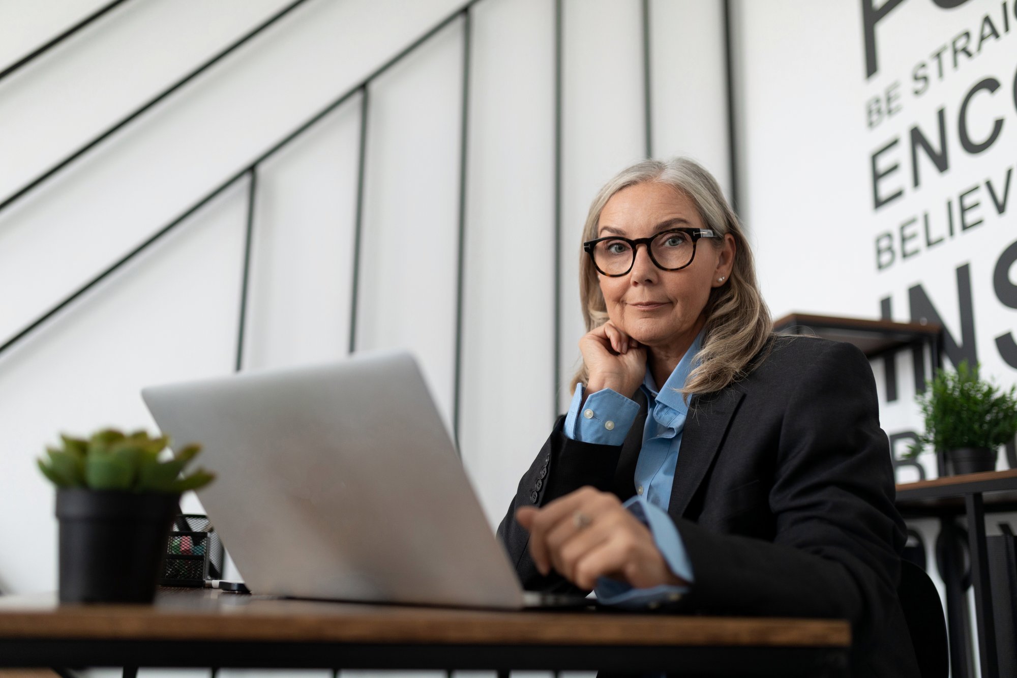 Business woman doing an inspection or thinking shutterstock_2267753389