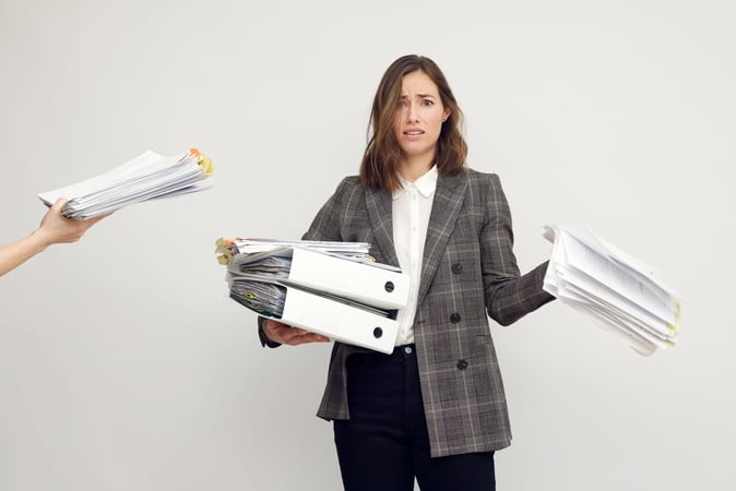 lawyer being stuffed with paper for manual EDD